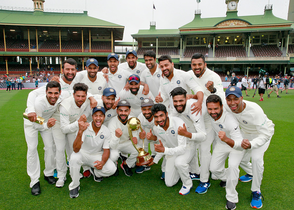 Virat Kohli and company pose with the trophy after winning their maiden Test series down under | Getty