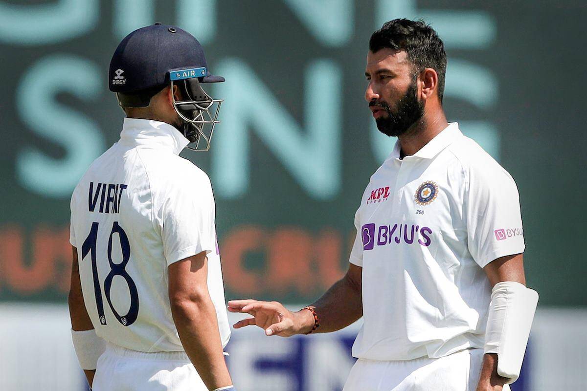 Virat Kohli and Cheteshwar Pujara | AFP