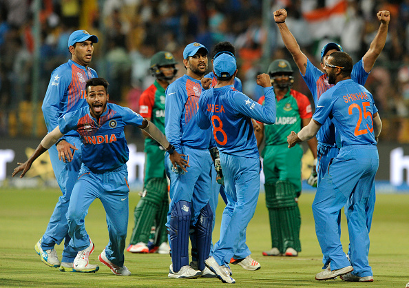 A jubilant Indian team after MS Dhoni runs out Mustafizur Rahman to win the game by one run | Getty