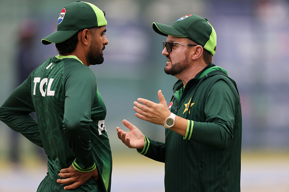 Mike Hesson and Babar Azam | Getty