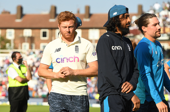 A disappointed England team looks on at the Oval | Getty