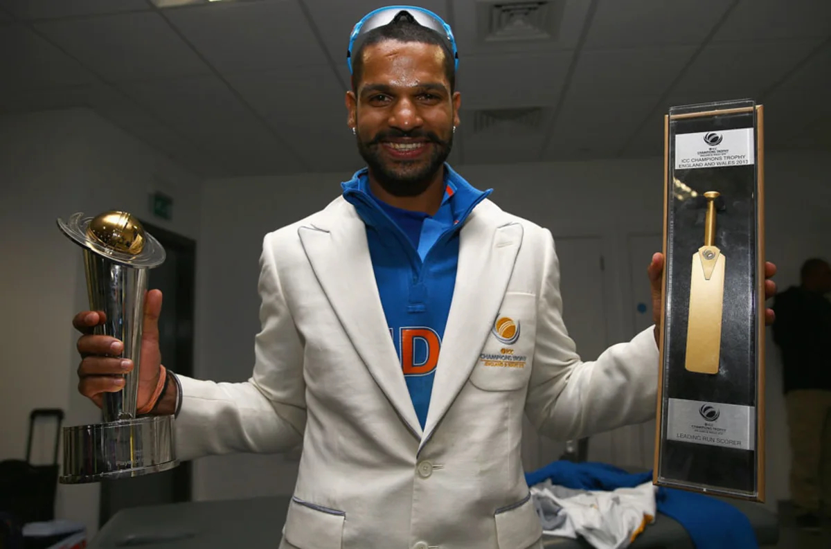 Shikhar Dhawan with golden bat and Player of Tournament awards from 2013 ICC Champions Trophy | Getty