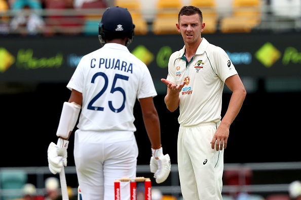 Cheteshwar Pujara and Josh Hazlewood | Getty