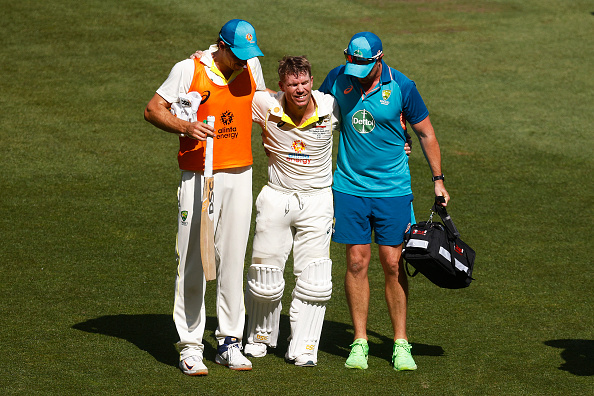 Warner was carried off the field due to cramps after completing his 200 | Getty