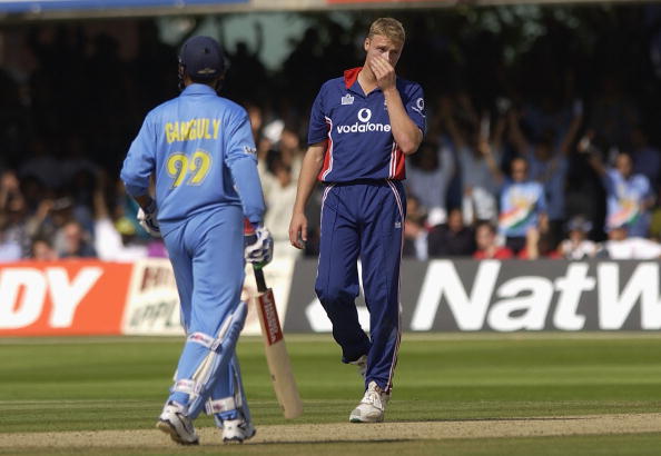 Andrew Flintoff reacts after being hit for a boundary by Sourav Ganguly | Getty