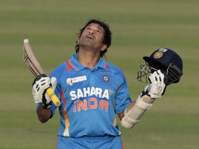 Sachin Tendulkar reacts after reaching his 100 hundreds milestone | Reuters