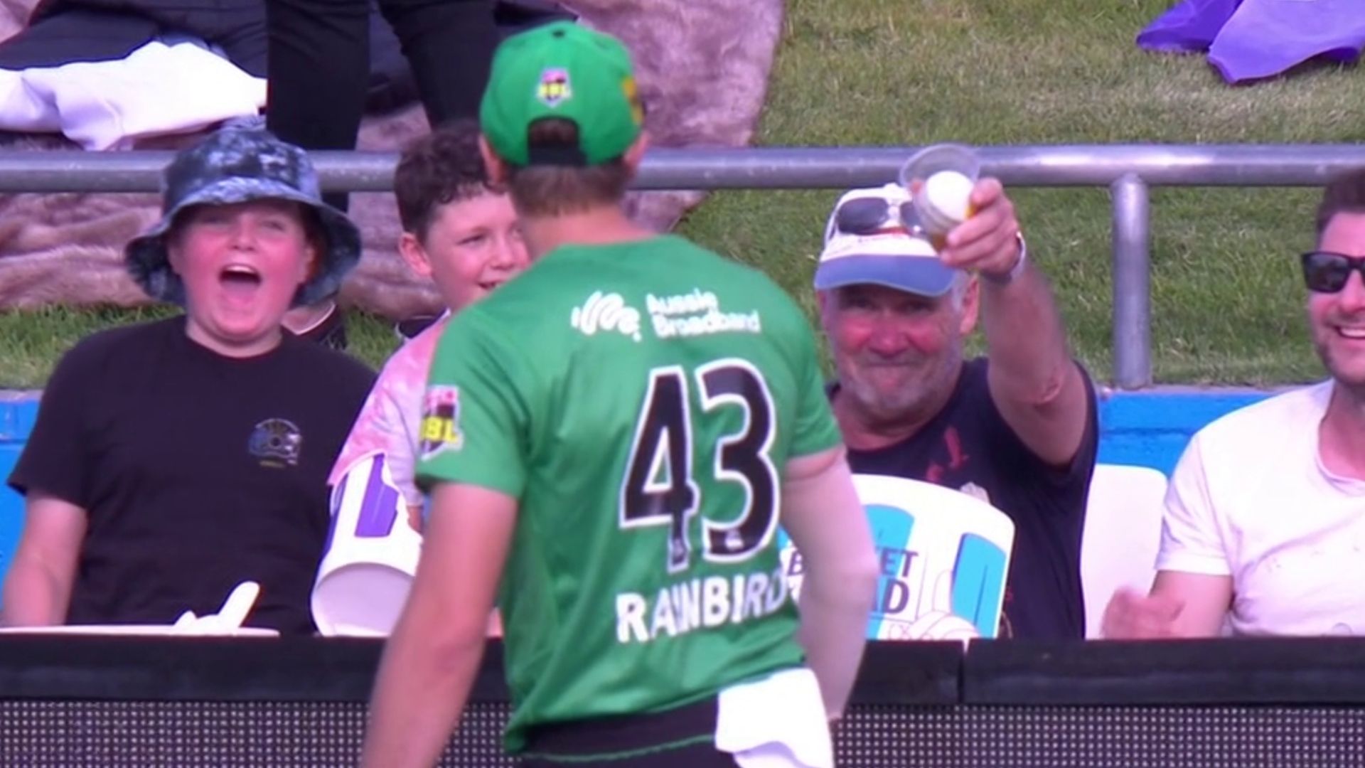 The old man with beer cup gulped the drink down before throwing the ball | Screengrab