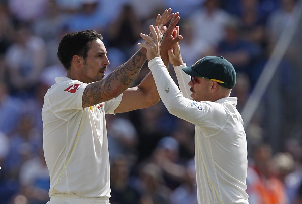 Mitchell Johnson and David Warner | Getty