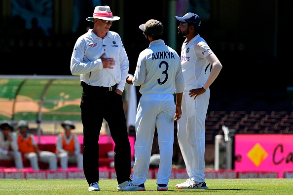 Rahane and Siraj talk to the umpire about the racial abuse | Getty