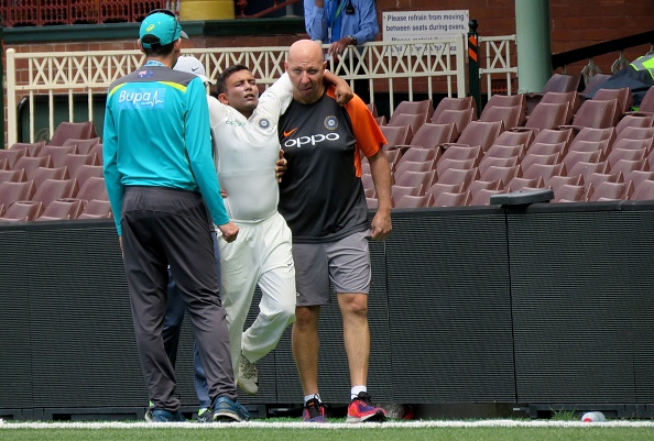 Prithvi Shaw is carried off after injuring his ankle whilst fielding | Getty