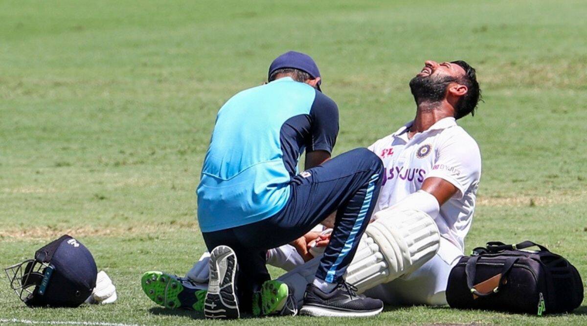 Cheteshwar Pujara being treated in Gabba after getting hit | Getty