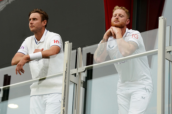 Broad and Stokes look on as rain hampers their chances of winning the Manchester Test | Getty