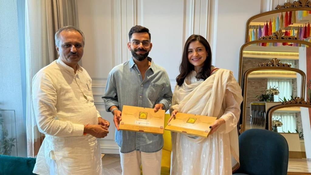 Virat Kohli and his wife Anushka Sharma receiving the invitation to attend the consecration ceremony of Ram Mandir | X