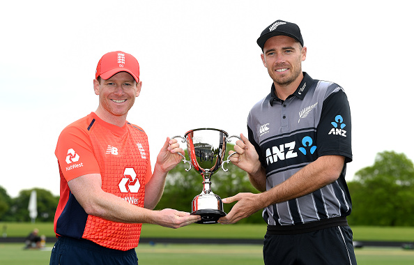 Eoin Morgan pose with the T20 International series trophy with Tim Southee | Getty Images