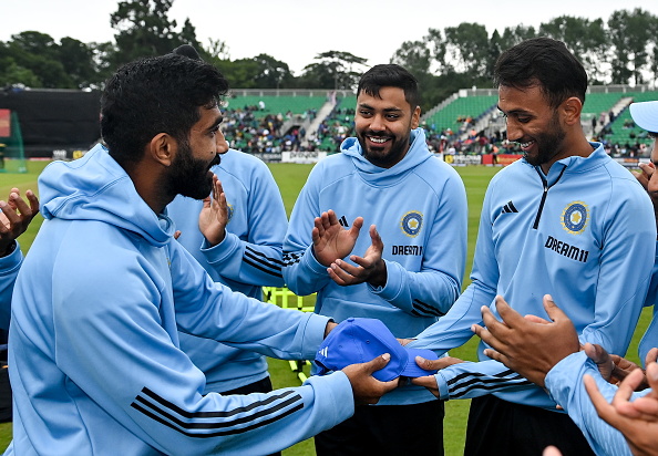 Prasidh Krishna receiving his T20I cap from Jasprit Bumrah | Getty