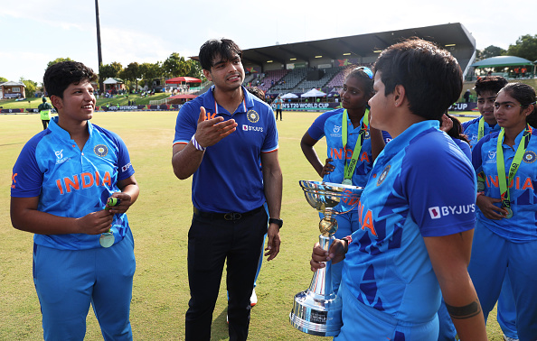 Neeraj Chopra with the U19 T20 World Cup winning Indian women's team | Getty