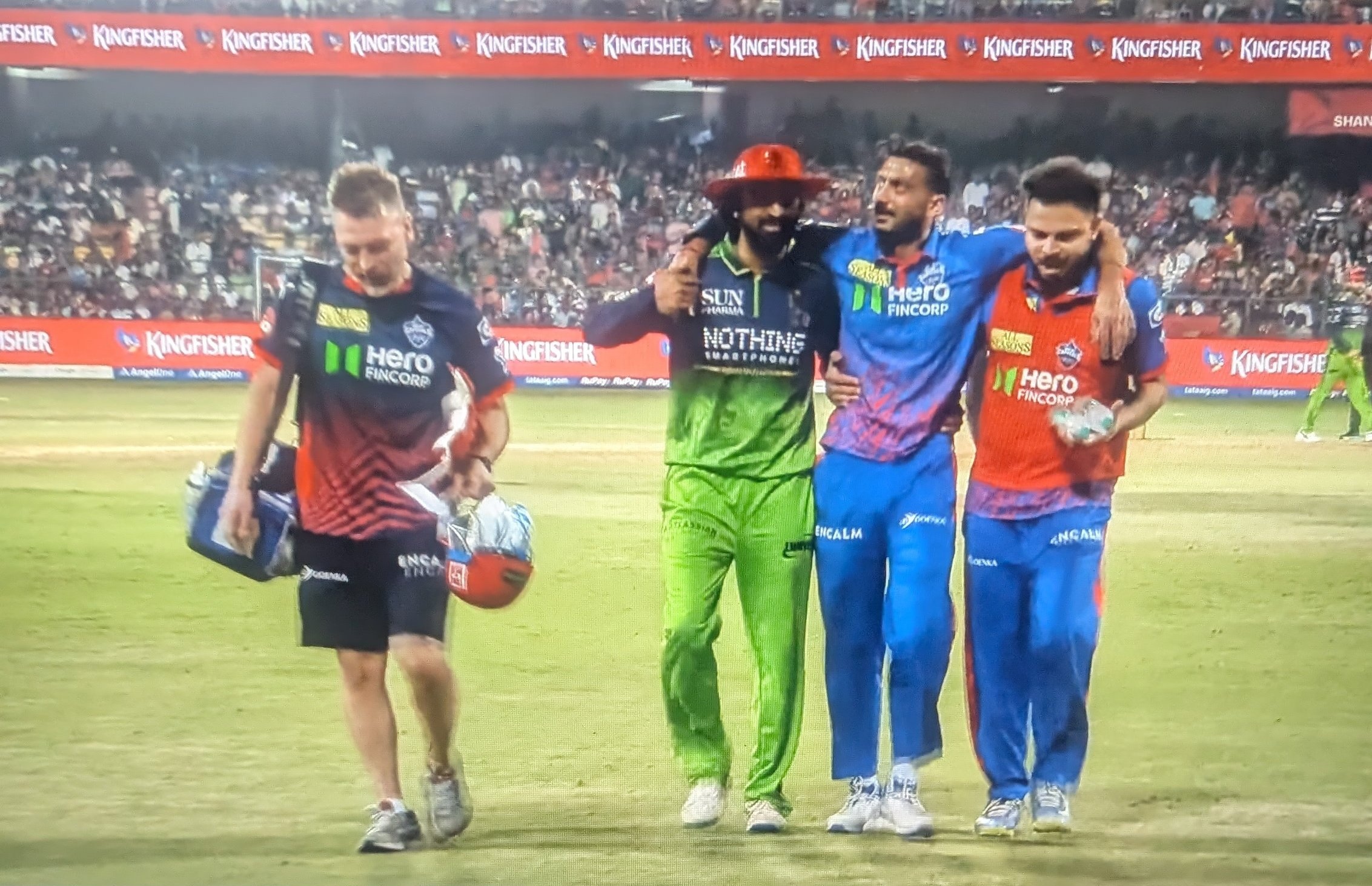 Krunal Pandya helping Axar Patel off the field | X