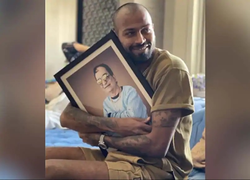 Hardik Pandya with his dad's photo