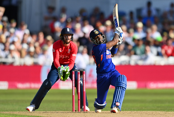 Suryakumar hits a six as Buttler watches on | Getty Images 