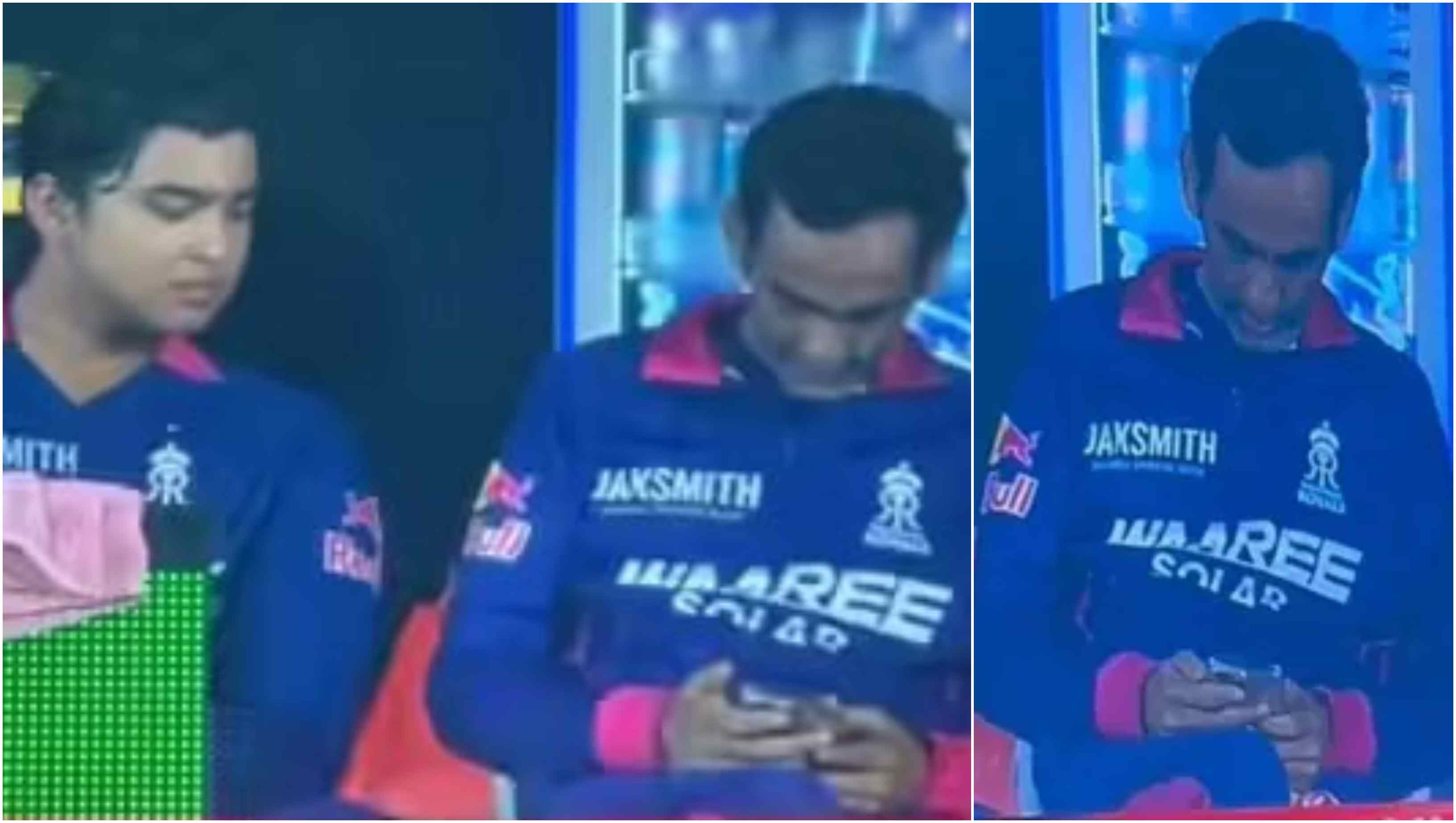 Romi Bhinder using a mobile phone in the team dugout | Screengrab