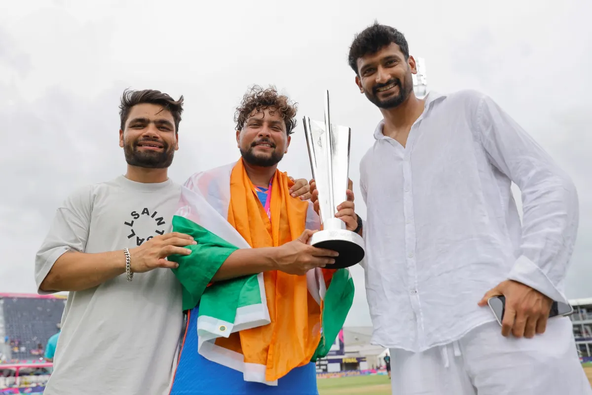 Khaleel Ahmed and Rinku Singh with Kuldeep Yadav and T20 World Cup trophy | Getty