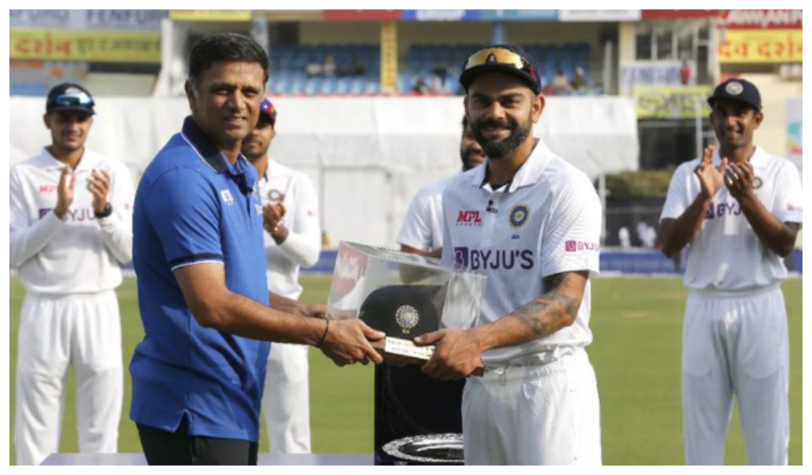 Virat Kohli receiving his 100th Test cap from Rahul Dravid | BCCI