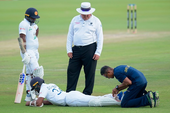 Dinesh Chandimal receives medical treatment from team physio | Getty Images