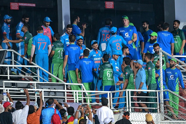 Indian and Pakistani players shaking hands after the game was called off | Getty
