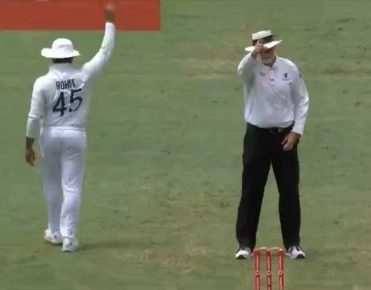 Rohit Sharma raising his finger in tandem with the on-field umpire | Screengrab