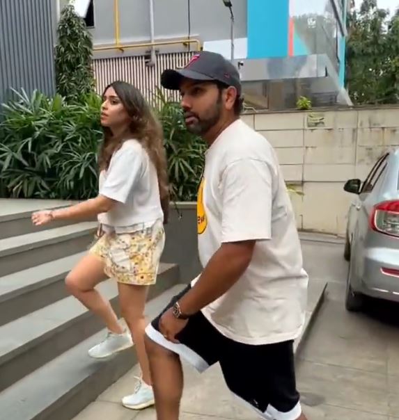 Rohit Sharma and Ritika Sajdeh arriving at an Adidas store in Mumbai | X