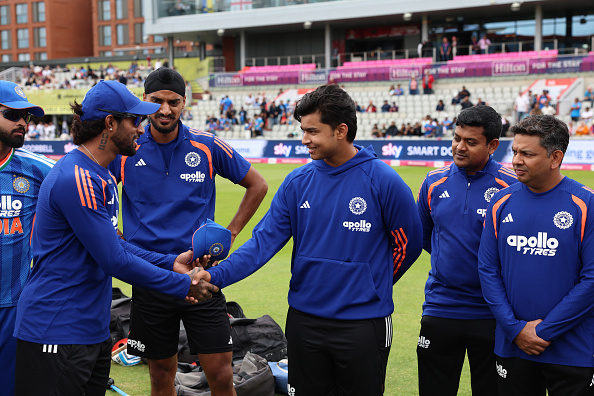 Vaibhav Sooryavanshi receiving his maiden India cap from Tilak Varma | Getty
