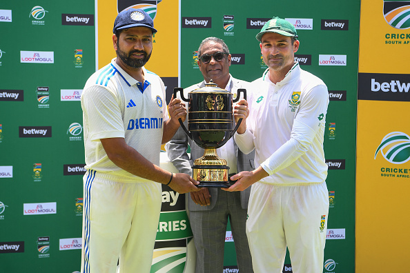 Rohit Sharma and Dean Elgar pose with the trophy | Getty Images