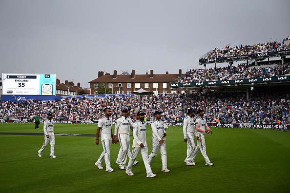 Indian players walking off the field due to bad light | Getty