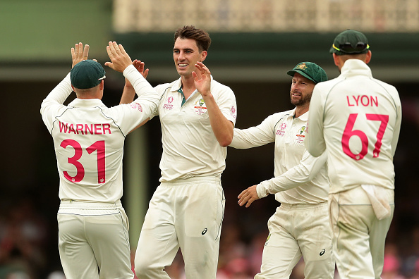 Pat Cummins celebrating a wicket with his teammates | Getty