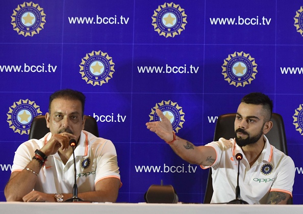 Ravi Shastri (L) and Virat Kohli (R) talking to bcci.tv | Getty Images