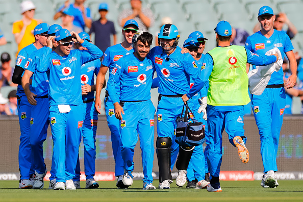 Rashid Khan celebrates with his teammates after claiming the hat-trick | Getty