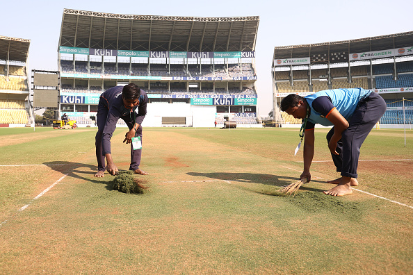 Ground keepers work on the Nagpur pitch | Getty
