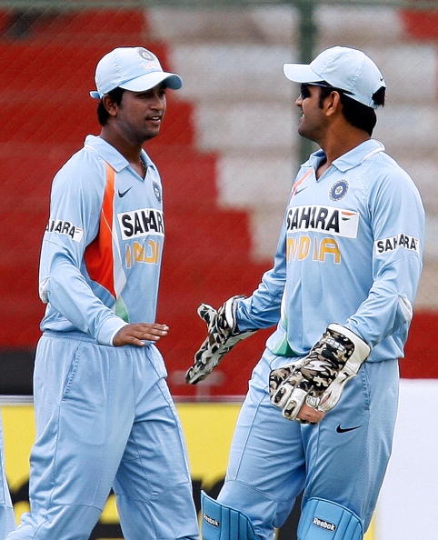 Pragyan Ojha and MS Dhoni | Getty