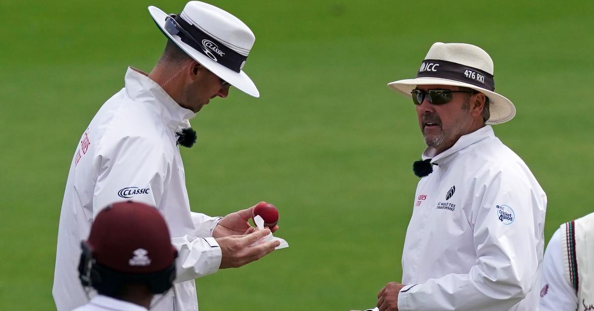 Umpire Micheal Gough rubbed the ball with sanitised tissue | AFP