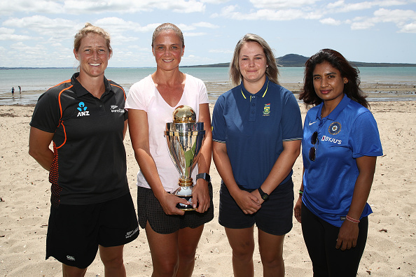Sophie Devine, Rebecca Rolls, Dane Van Niekerk and Mithali Raj pose with the 2021 World Cup trophy | Getty Images