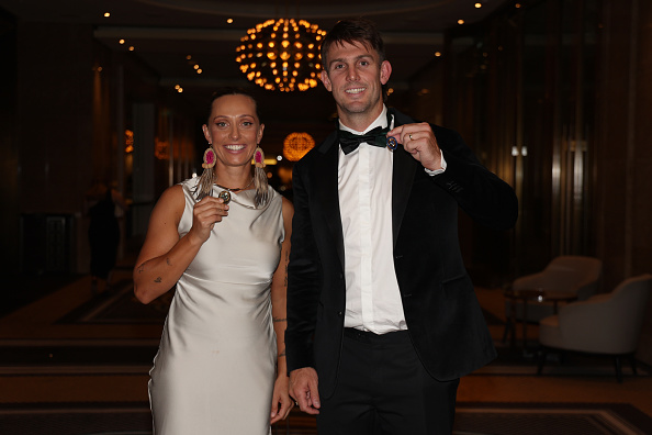 Ash Gardner and Mitchell Marsh showing off their medal wins | Getty