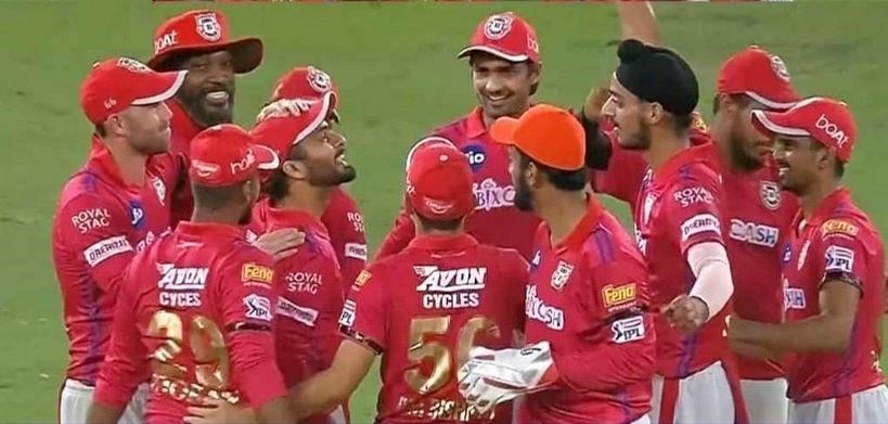 Mandeep Singh surrounded by his KXIP teammates celebrate the win while paying tribute to his father