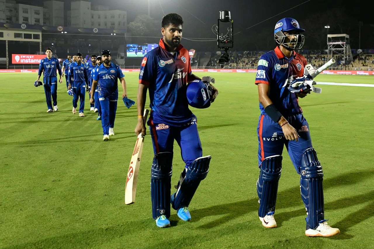 Lalit Yadav and Akshar Patel walk back after winning the match for DC against MI | IPL-BCCI