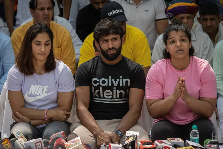 Vinesh Phogat, Bajrang Punia and Sakshi Malik at the sit-in | Twitter