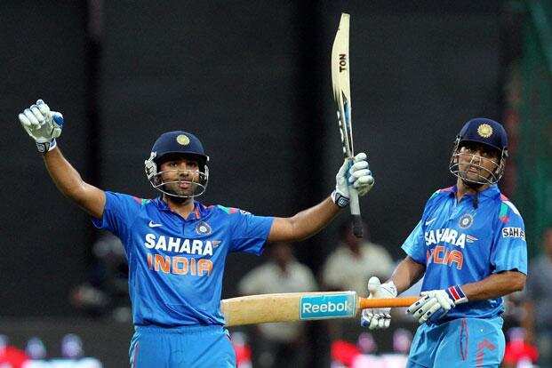 Rohit Sharma celebrates his first double ton with MS Dhoni in background  