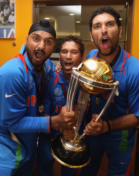 Harbhajan Singh, Sachin Tendulkar and Yuvraj Singh with World Cup trophy | Getty