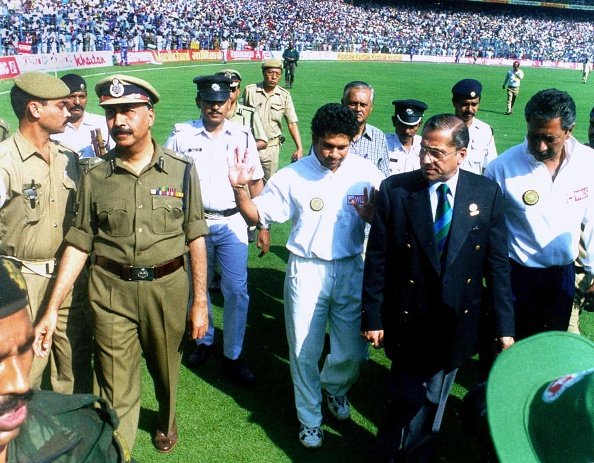 Sachin Tendulkar tries to pacify the crowd in Kolkata who rioted after his run out | Getty