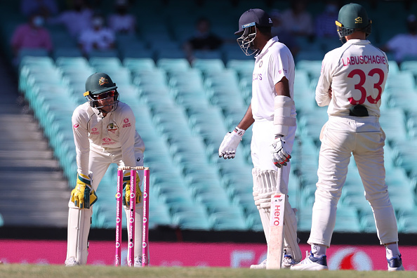 Tim Paine and R Ashwin exchange a few words | Getty