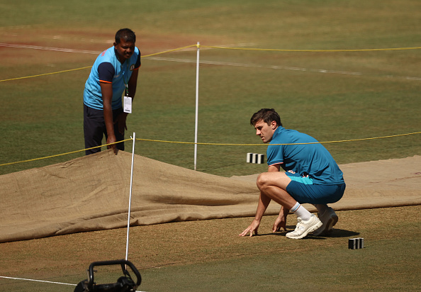 Pat Cummins assessing the pitch ahead of first Test | Getty