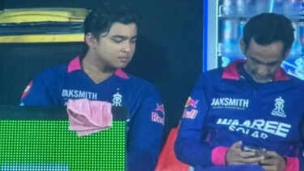 Romi Bhinder was seen using his mobile phone in RR dugout with Vaibhav Sooryavanshi watching | X